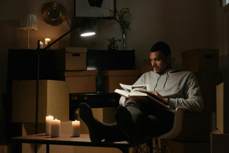 A man reading a growing cannnabis book while relaxing.