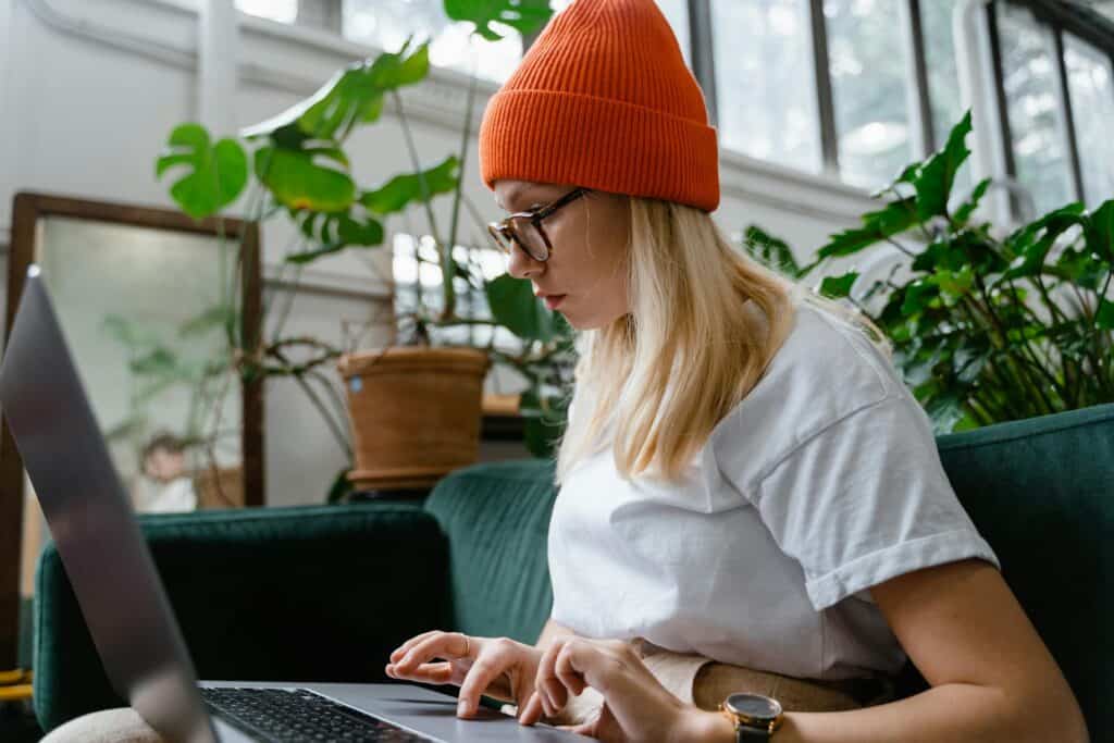 An image of a woman researching cannabis strain for her first medical grow.
